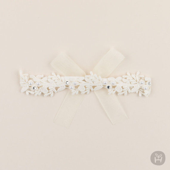Thumbnail: The Lillian Lace Baby Hairband is a romantic accessory that adds a touch of elegance to your little one's outfit. Adorned wit