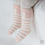 Thumbnail: The Tori Winter Baby Knee Socks Set includes soft and cozy Taktel socks, crafted with a blend of cotton and Taktel yarn