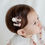 Thumbnail: The Mignon Baby Hairpin Set features a delightful 2-in-1 design that combines a charming pom-pom with a ribbon, beautifully a