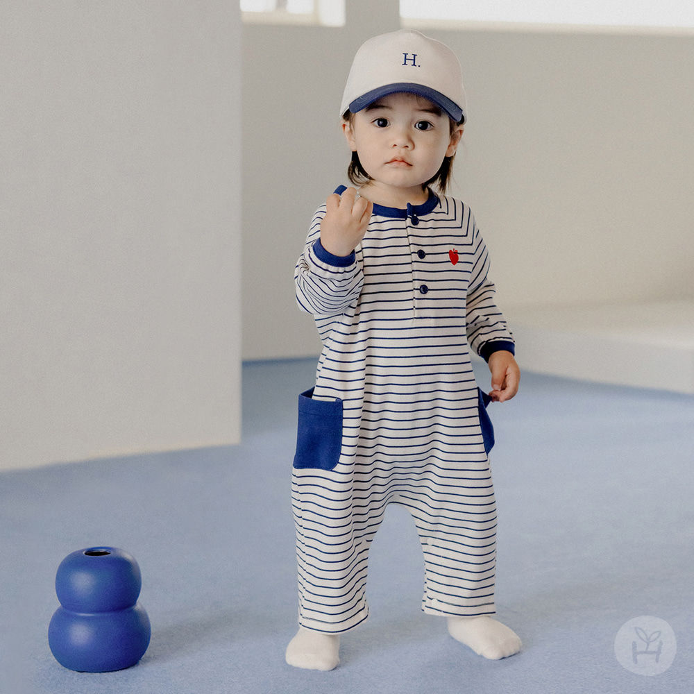 The Huggable Baby Play Suit features an attractive navy striped fabric that is both stylish and functional. Designed with a l