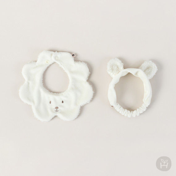 Thumbnail: The Hola Bear Baby Bib + Hairband Set is a charming and versatile duo that combines functionality with adorable style. This s