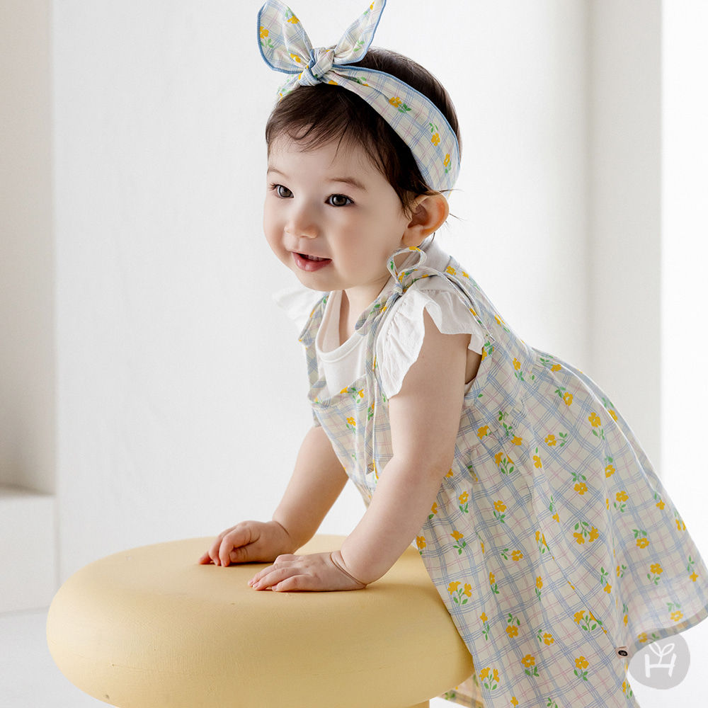 Introducing the Esia Bustier Mini Baby One-Piece, featuring a chic cool-colored checkered floral print that enhances your bab