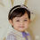 Thumbnail: Introducing the Ellis Baby Hairband, a charming accessory featuring a lovely purple check ribbon adorned with a gold ribbon c