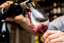 Pouring Red Wine in Glass