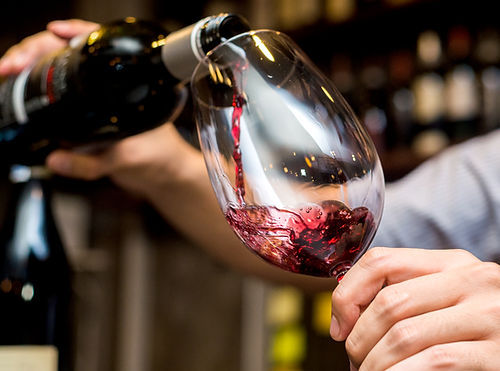 Pouring Red Wine in Glass