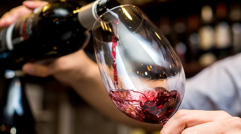 Pouring Red Wine in Glass