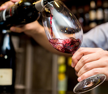 Pouring Red Wine in Glass