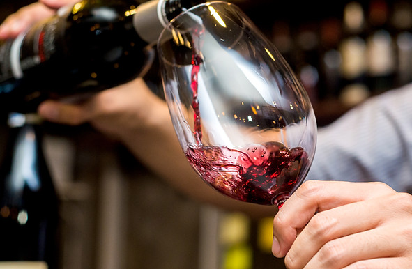 Pouring Red Wine in Glass