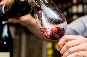 Pouring Red Wine in Glass