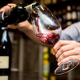 Pouring Red Wine in Glass