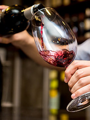 Pouring Red Wine in Glass