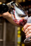 Pouring Red Wine in Glass