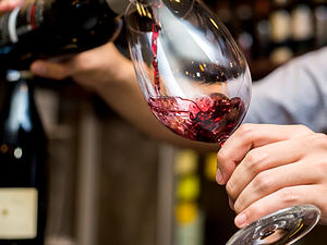 Pouring Red Wine in Glass