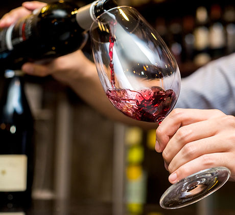 Pouring Red Wine in Glass