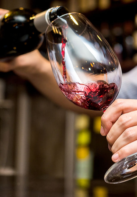 Pouring Red Wine in Glass
