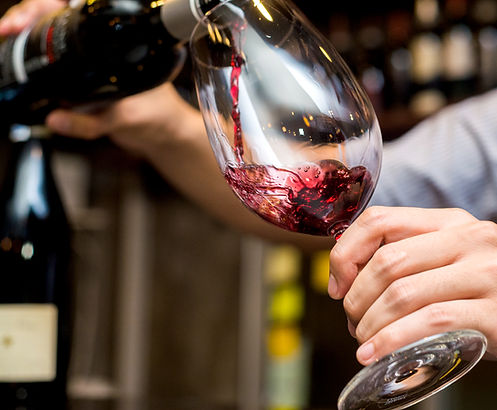 Pouring Red Wine in Glass