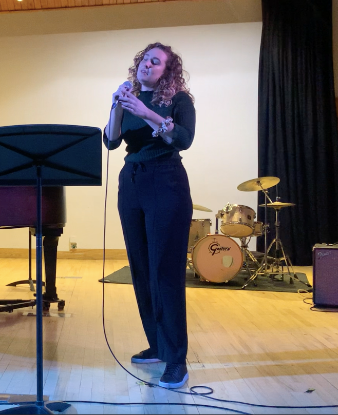 Sabrina singing on stage