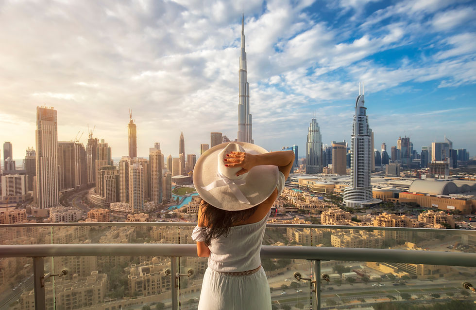 lady with hat in downtown dubai overlooking burj khalifa