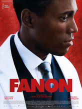 A movie poster for 'Fanon,' directed by Jean-Claude Barny. The close-up features a serious-looking Black man wearing a white suit jacket, black vest, and a tie, against a red textured background. The film's title, 'FANON,' appears in bold red capital letters across the lower part of the poster. The names 'Alexandre Bouyer' and 'Déborah François' are also displayed. A festival logo in the top left corner indicates the film was presented at the Marrakech International Film Festival.