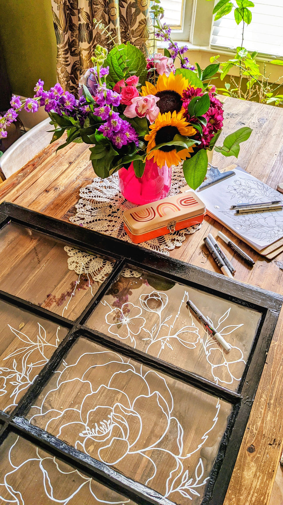 Antique window with floral illustration on glass