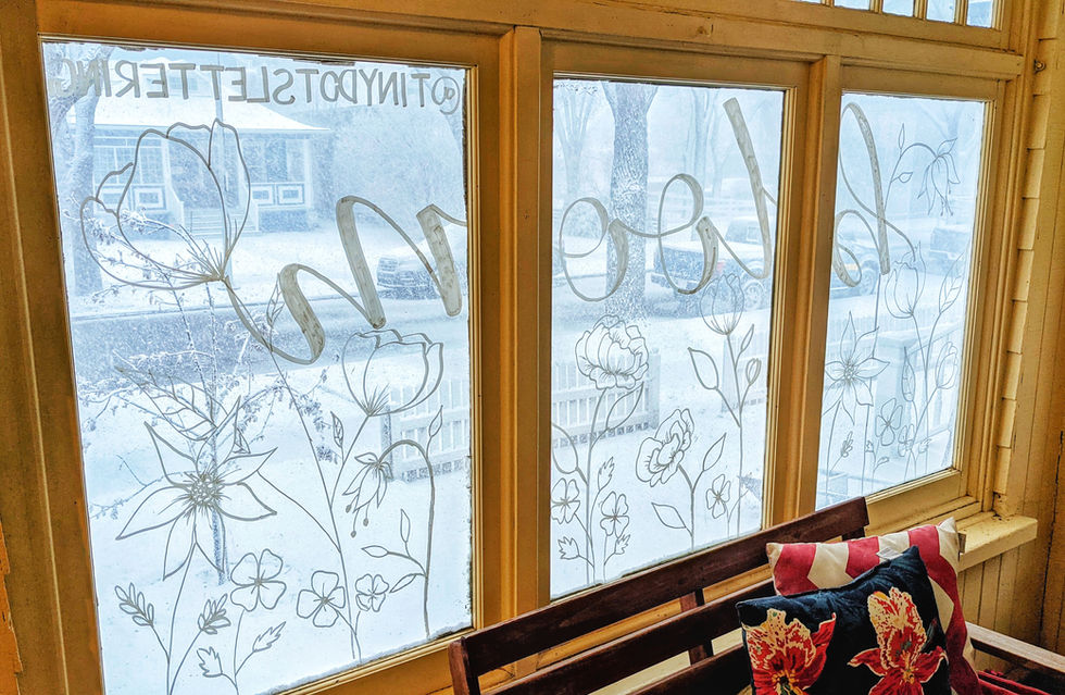 seasonal window murals on a home