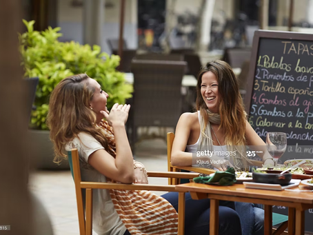 woman with PCOS eating in a restaurant