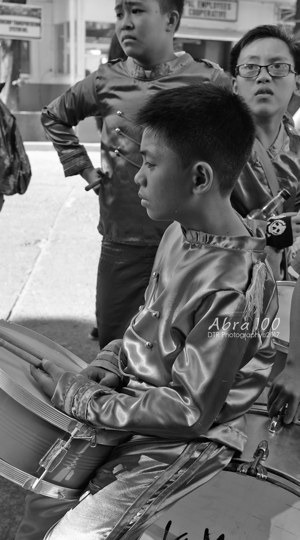 a black and white photo of a boy taken by abra 100