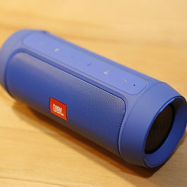 a large blue bluetooth speaker