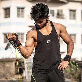 An athletic man exercising with resistance bands