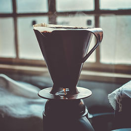 a glass cup filled with espresso
