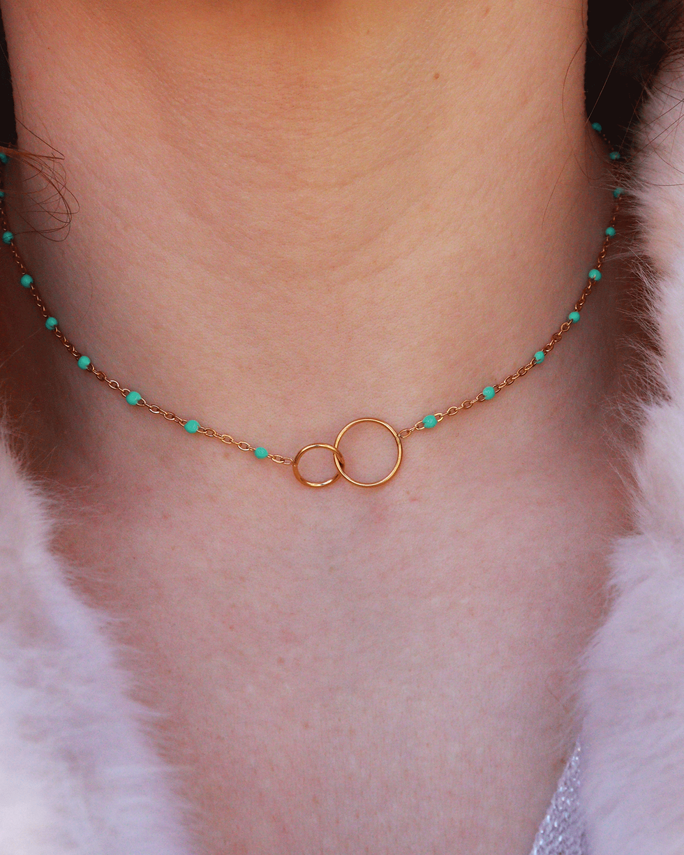 Miniature : Collier perlé anneaux entrelacés turquoise acier doré