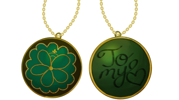 Digitally painted illustration of an emerald amulet with gold detailing that says, "To my heart."