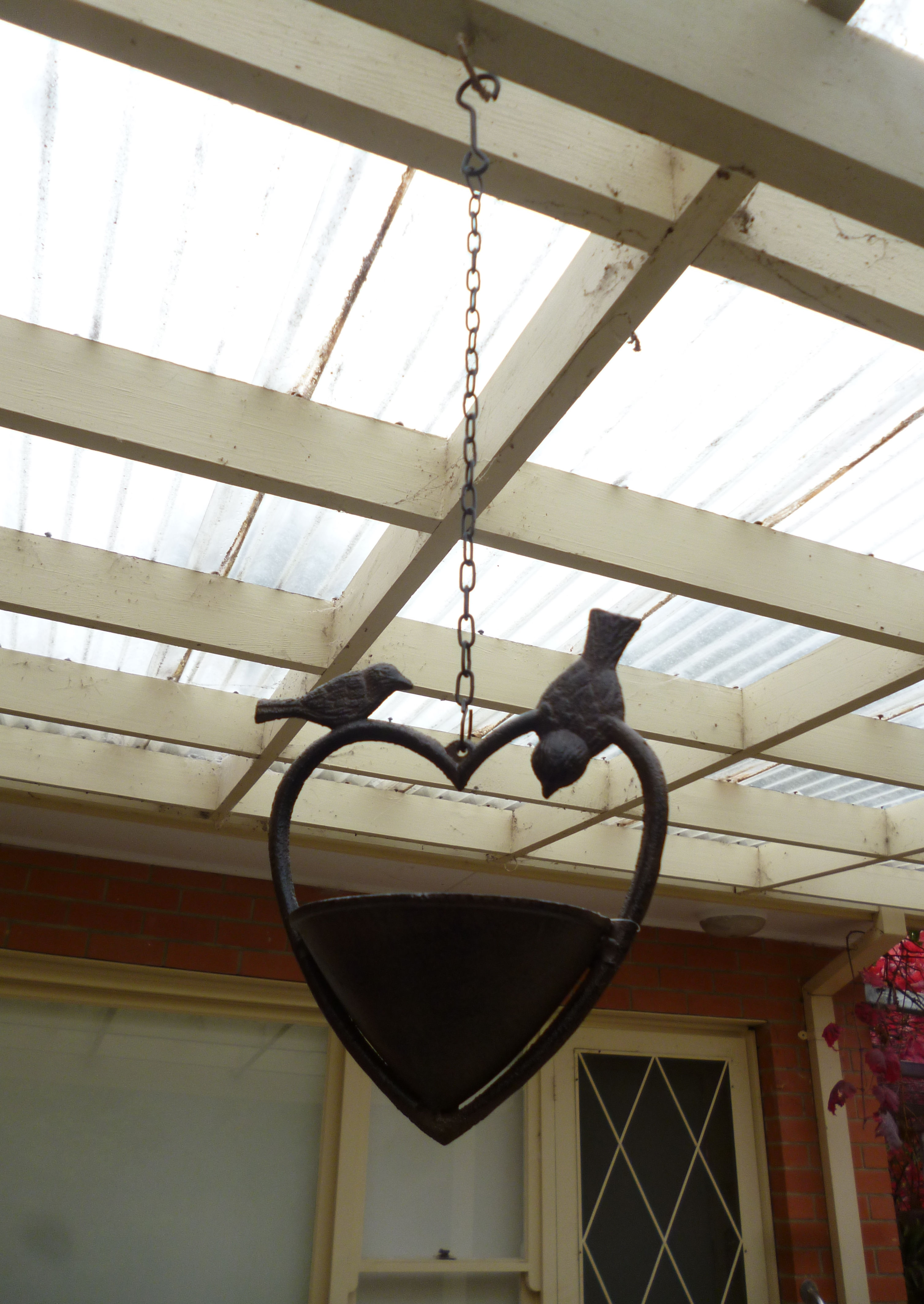Rustic cast iron hanging bird basket