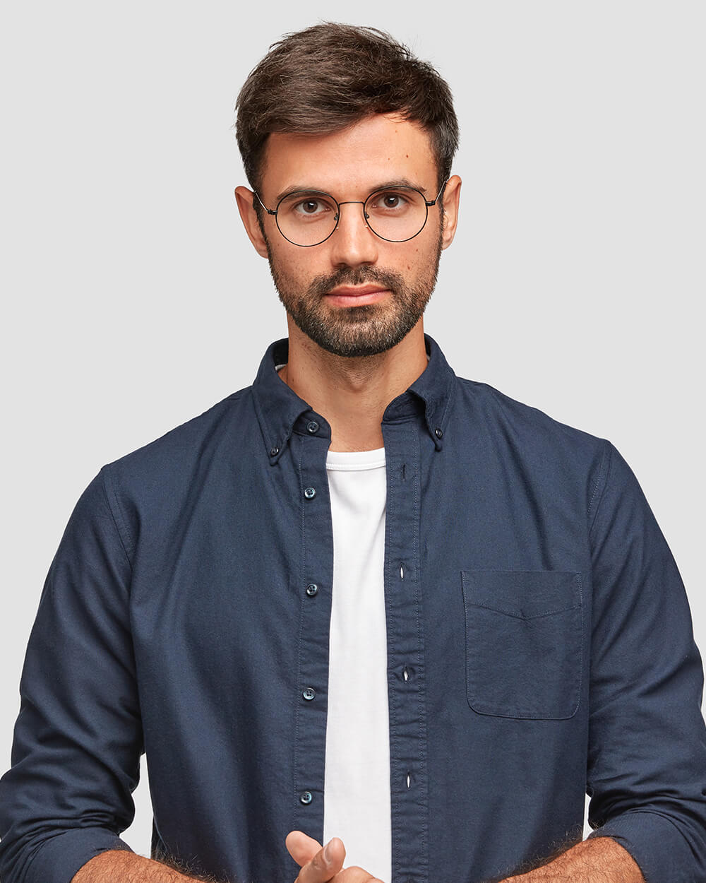 man-in-suit-shirt-hands-clasped.jpg