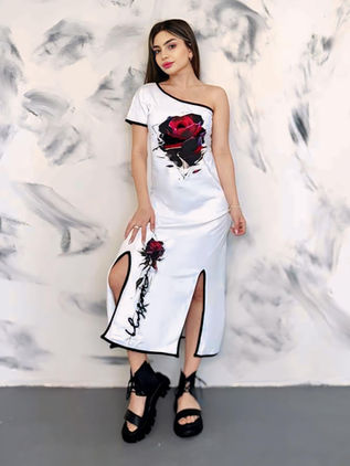 White one-shoulder dress, printed with roses and black trim. Design by Samanta X