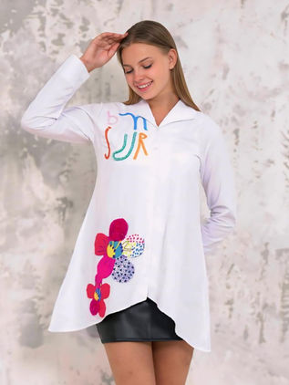 Asymmetrical women's white shirt printed and embroidered with colored stones. Design by Samanta X