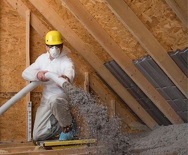 Technician capping attic with new pest-controlling insulation for improved efficiency