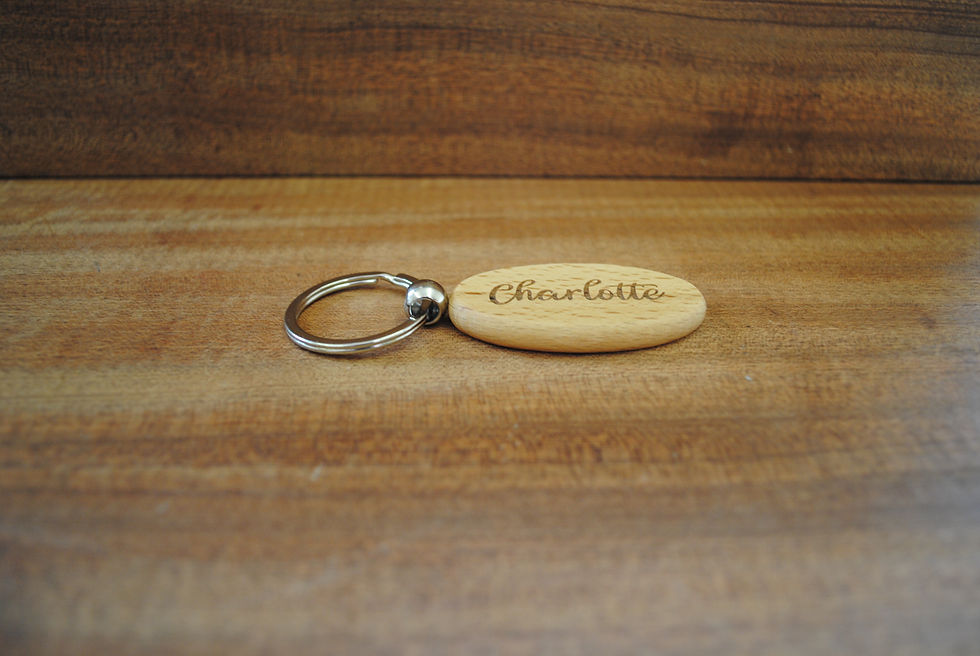 Thumbnail: Oval shape wood keyring with spilt ring, angled 2 view