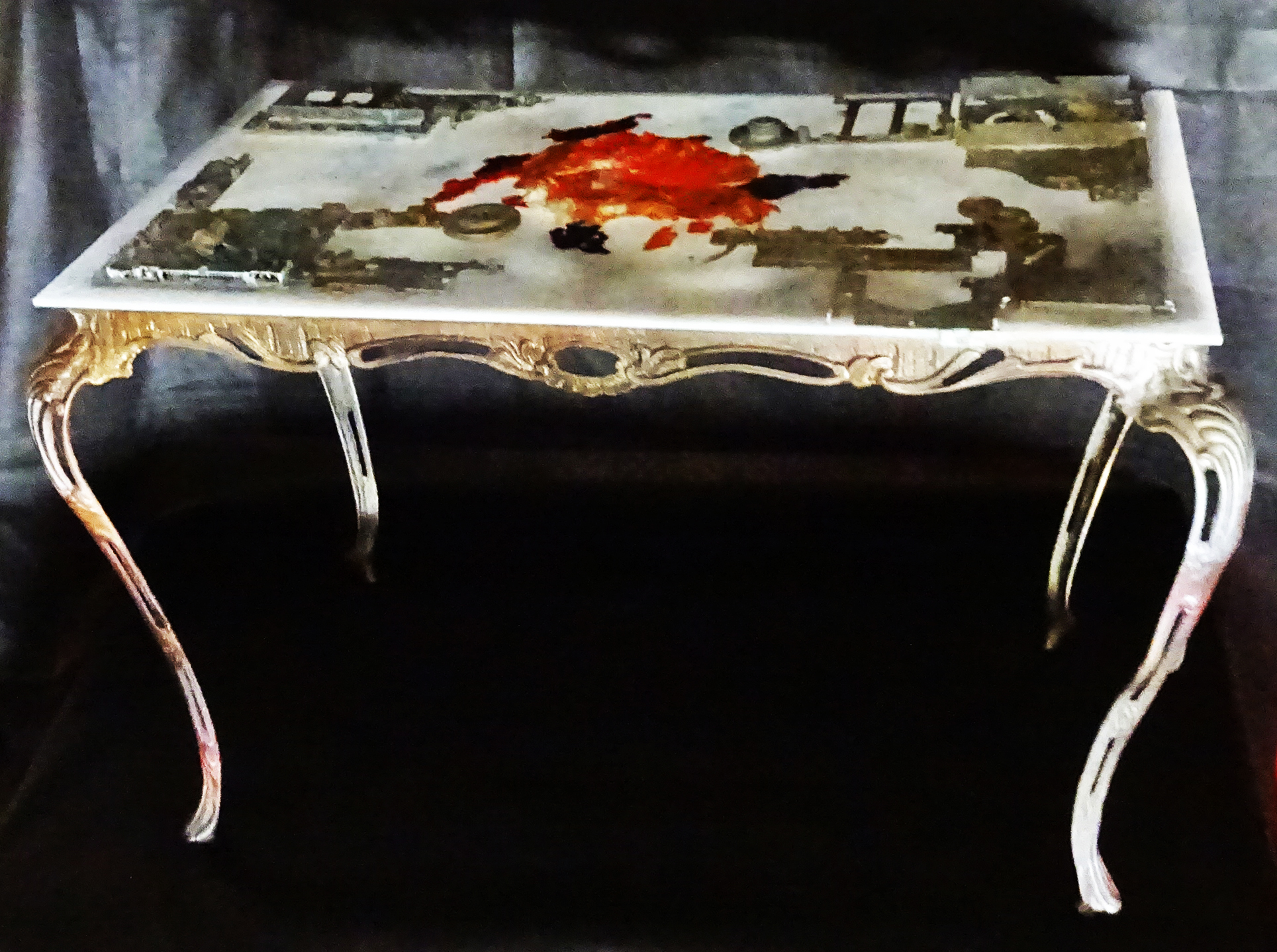 THE FROG IS ON THE TABLE