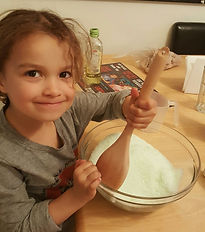 Little girl, mixing bowl, bath salts