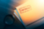 Private investigator desk with confidential envelopes.jpg