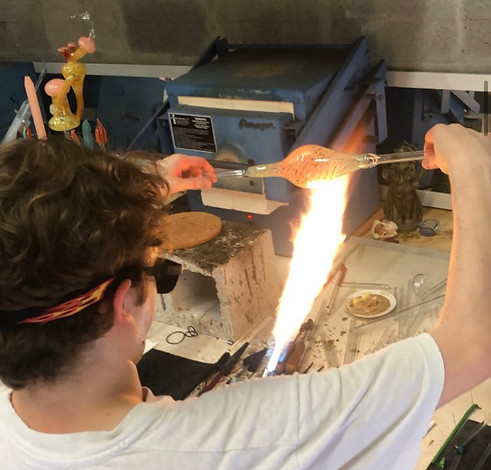 Beginner glassblowers in Miami learn the basics of shaping molten glass in a safe and supportive environment.