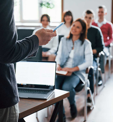 everyone-is-smiling-listens-group-people-business-conference-modern-classroom-daytime.jpg