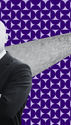 Prof. Marco Pravetoni, a white man in a suit, crosses his arms. Behind him is a pencil tip with enough fentanyl in white powdered form to kill a person.