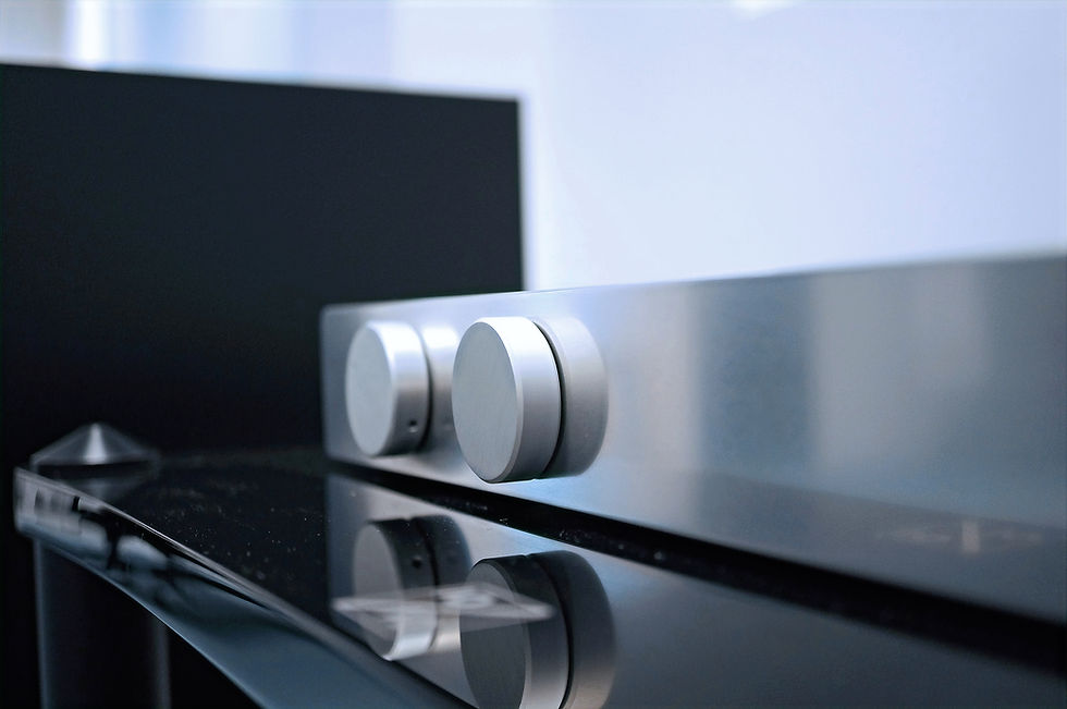 High angle view of a vintage tube amplifier next to a modern solid state amplifier