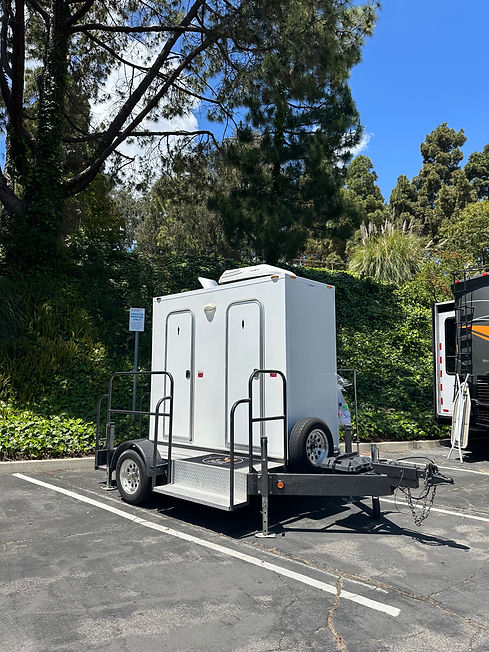 exterior photo of one of two portable restroom trailers provided on behalf of movingstars motorhomes.