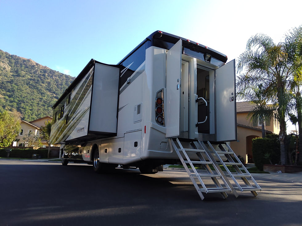 rear accessible bathrooms with doors open and extendable staircase to floor.