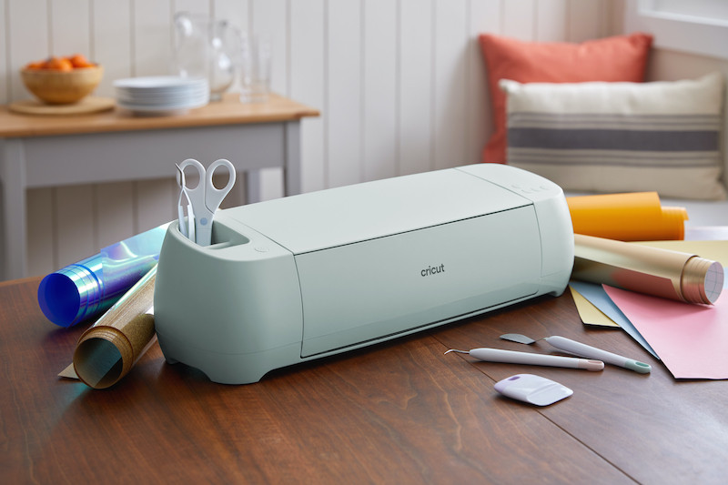 Cricut Explore with vinyl and tools