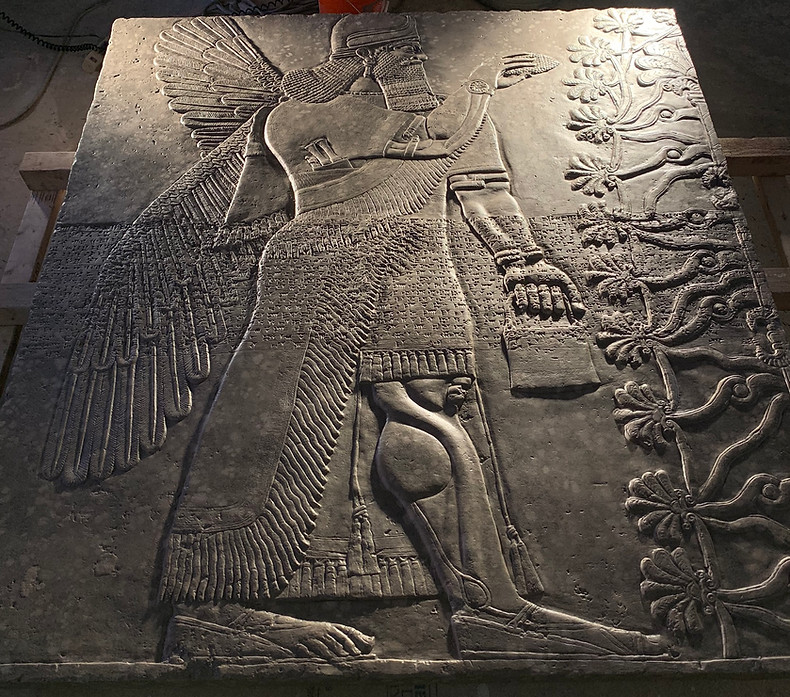 Plaster cast of an Assyrian bas-relief, finished to look like stone