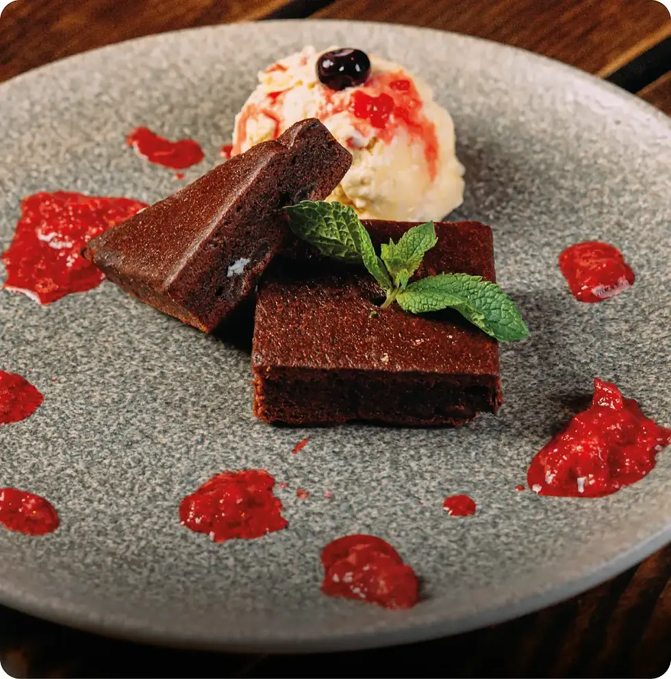 burnt cheesecake w raspberry sauce.webp